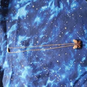 Delicate hand made leather butterfly necklace. Piece is about 1" wide.